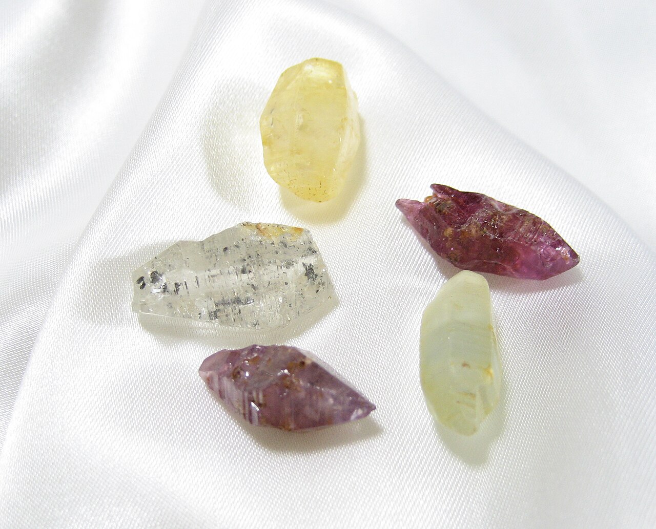 Natural rough sapphire crystals in several colours