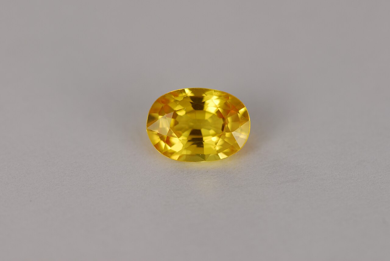 An oval-cut yellow Ceylon sapphire weighing approximately one carat